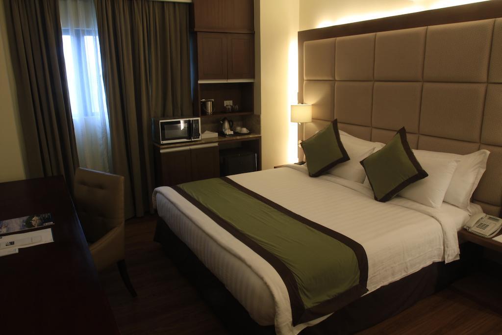 SanTomas Suites Santo Tomas Quarto foto