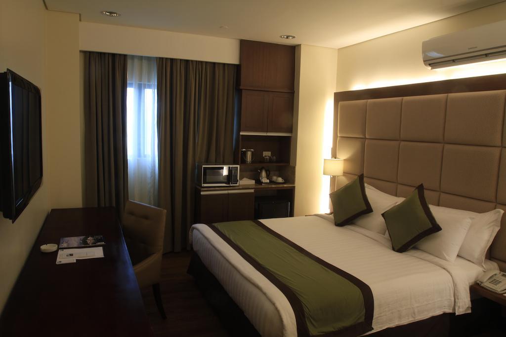 SanTomas Suites Santo Tomas Quarto foto